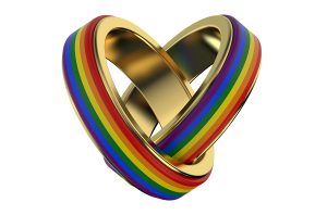 Colorful rainbow heart-shaped ring with gold accents symbolizing love and diversity.
