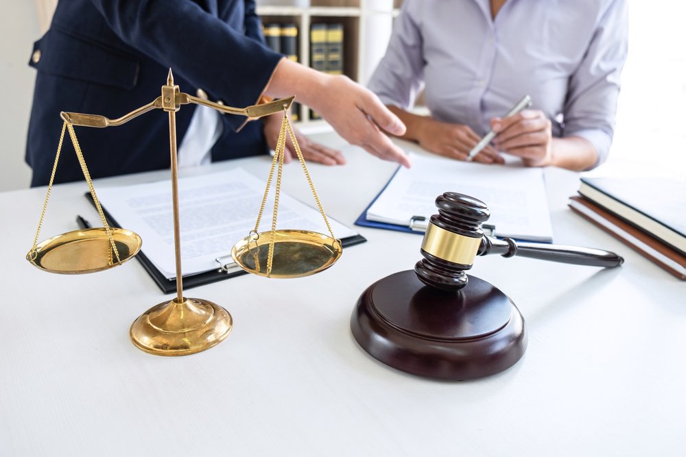 Professional,Female,Lawyer,Or,Counselor,Discussing,Negotiation,Legal,Case,With