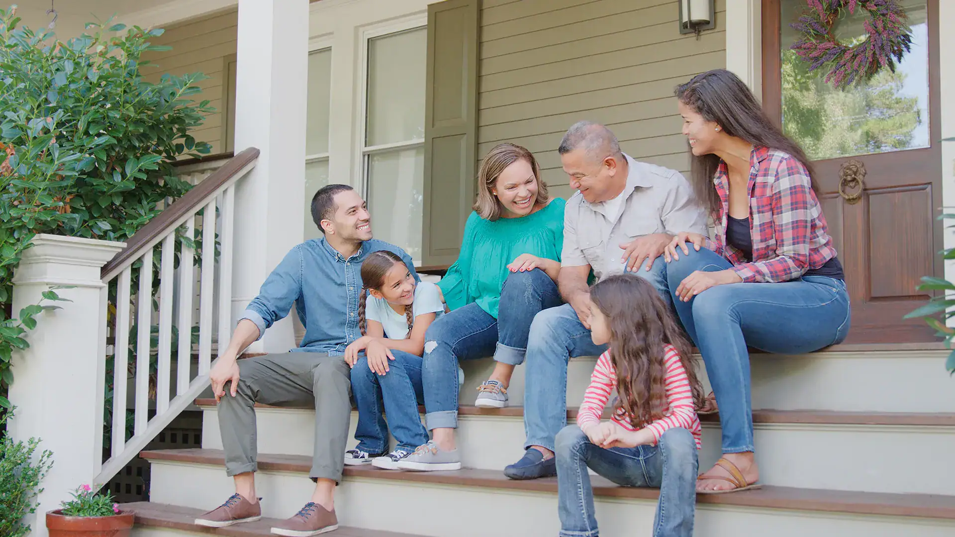 Family standing together on their front porch