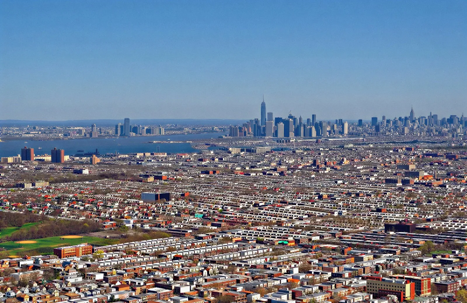 Aerial view of Brooklyn with the Manhattan skyline behind