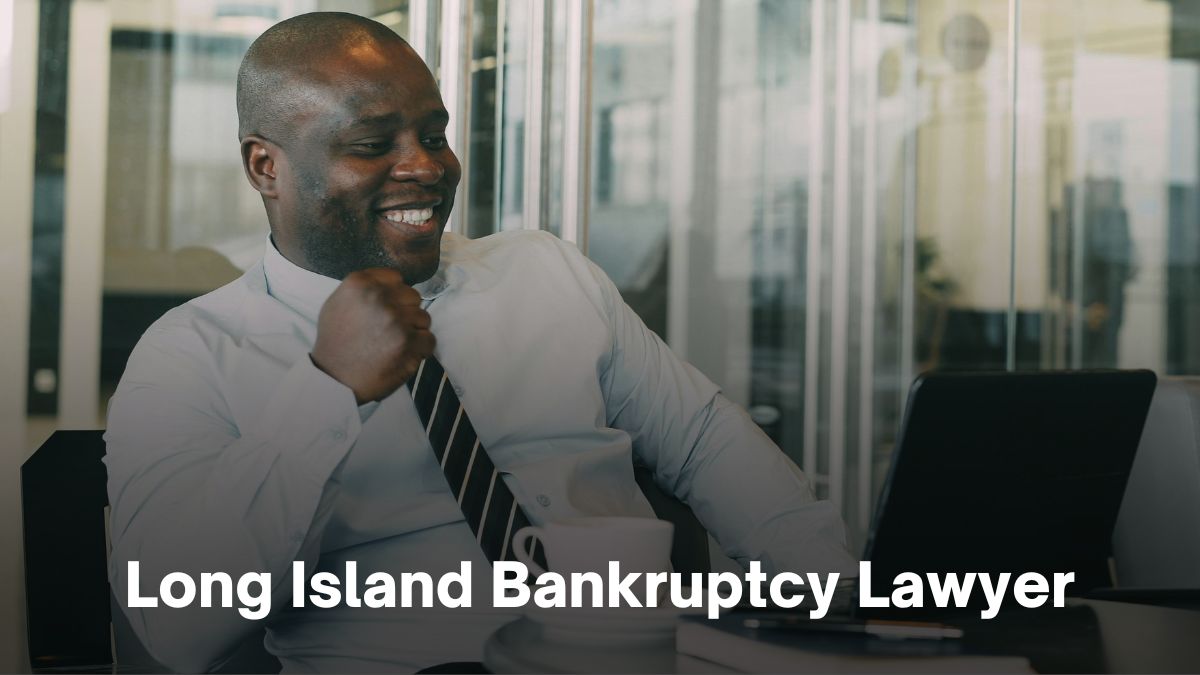 A smiling man in a shirt and tie sits at a desk with text showing "Bankruptcy & Foreclosure Attorneys.