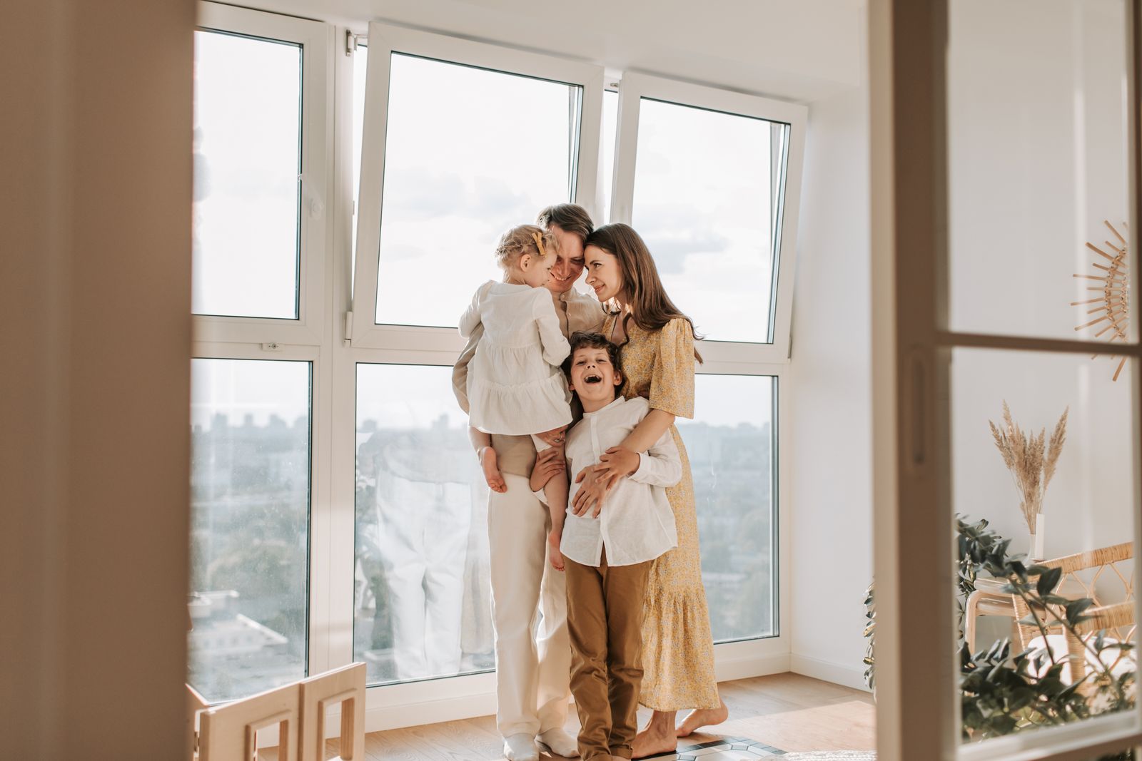 Family gathered by a sunny window