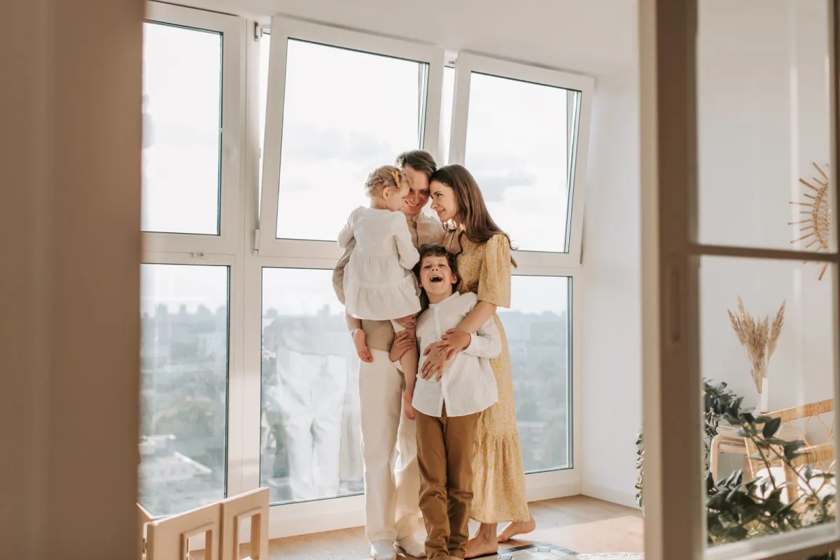 Family gathered by a sunny window