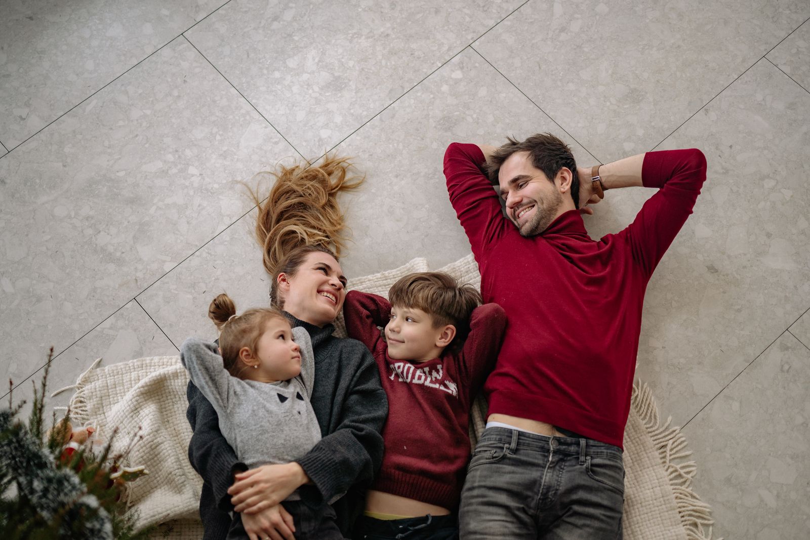Father relaxing with his two children at home