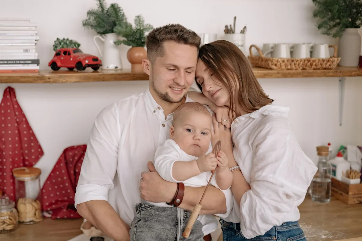 Happy family with young children at home