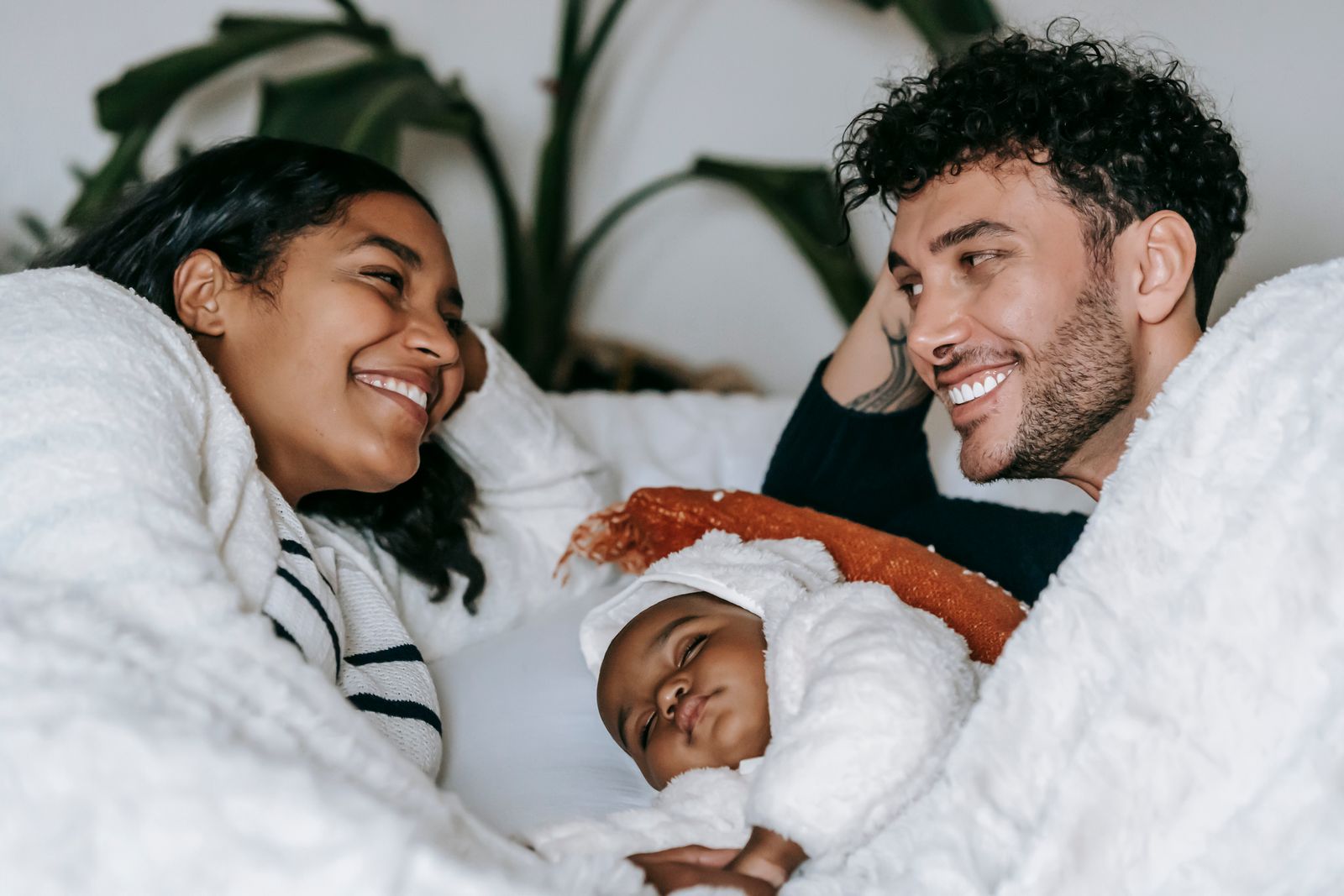 Joyful couple with their newborn