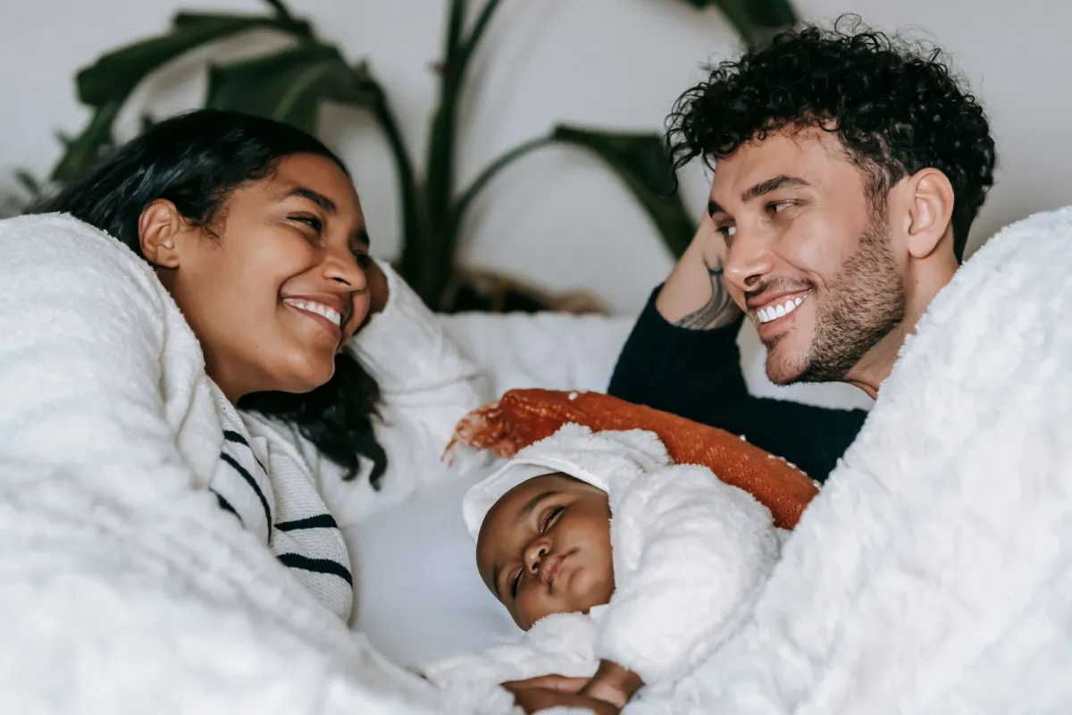 Joyful couple with their newborn