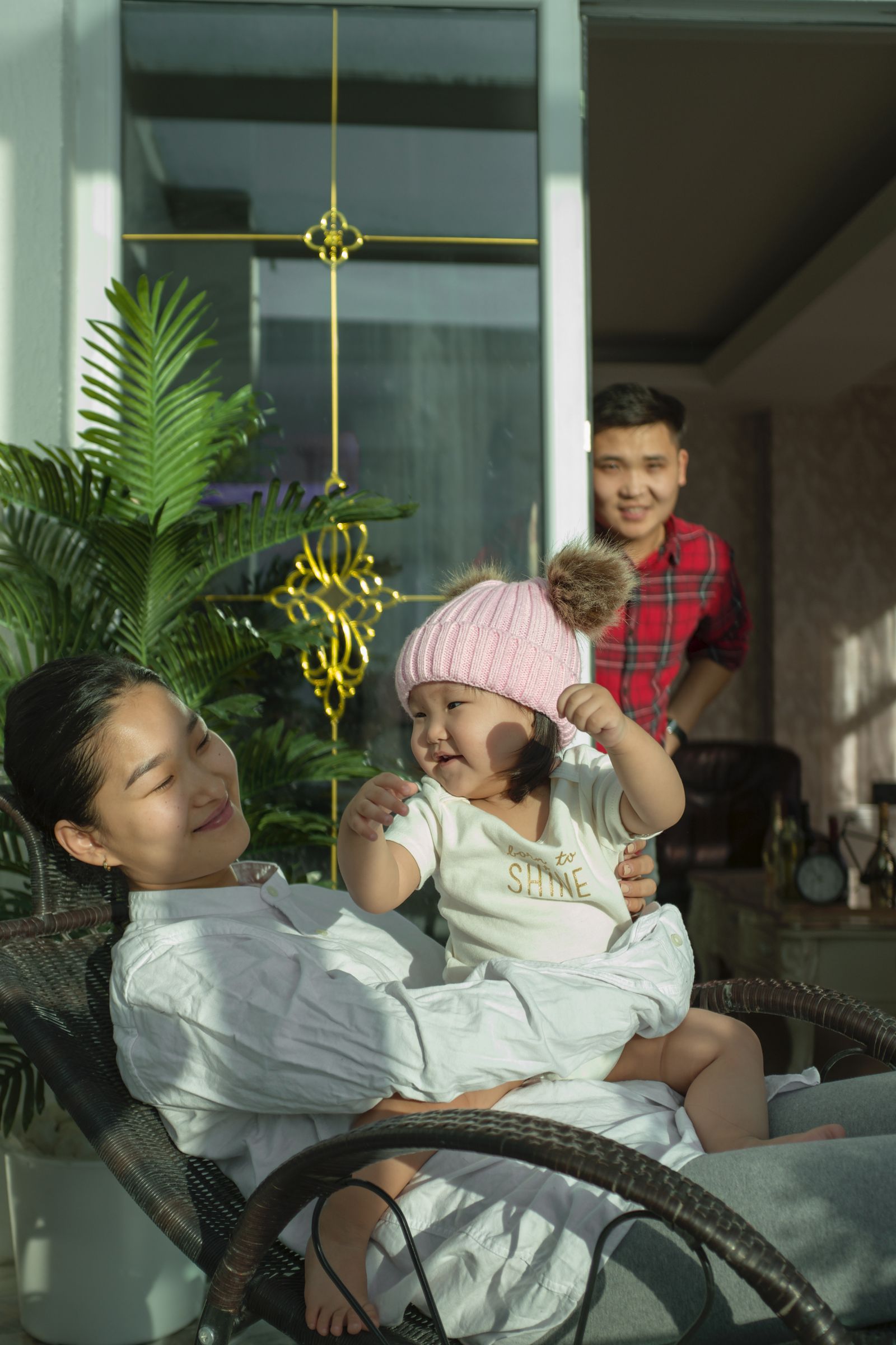 A joyful family unpacking moving boxes together as they settle into their home